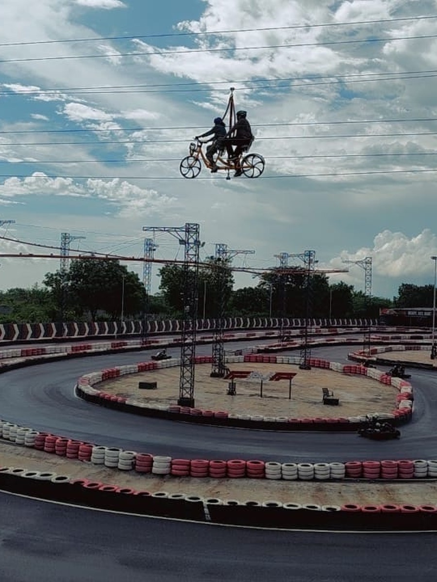 A go-kart track and a flying bicycle